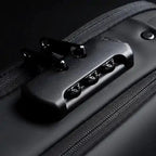Mandotos Elite Leather Sling Bag showing its sleek black leather design with adjustable strap and compact size.