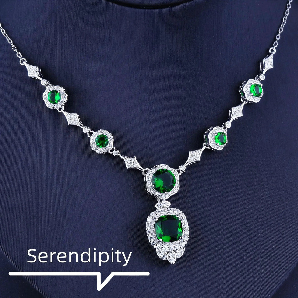 Emerald Elegance white gold necklace featuring a central emerald gemstone and delicate chain, crafted by MANDOTOS.