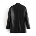 Mandotos Farah faux leather blazer featuring a tailored fit, lapel collar, and sleek black finish on a model.