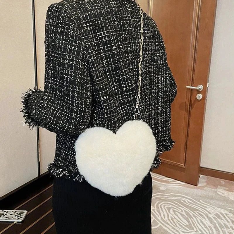 Mandotos women's heart-shaped faux fur crossbody bag with plush texture, chain shoulder strap, ideal for stylish casual or shopper use.