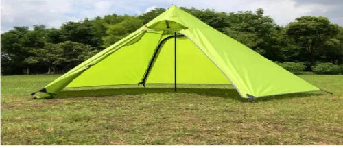 Mandotos Featherlight Pyramid Camp Shelter set up outdoors, showcasing lightweight, durable camping shelter with stakes and guy lines.