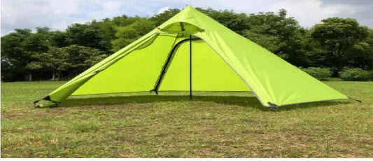 Mandotos Featherlight Pyramid Camp Shelter set up outdoors, showcasing lightweight, durable camping shelter with stakes and guy lines.