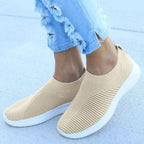 Mandotos flat knitted shoes in neutral tones, showcasing their comfortable, stylish design and textured knit upper.