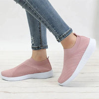 Mandotos flat knitted shoes in beige with a sleek design, featuring a comfortable slip-on style and textured knit upper.