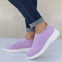 Mandotos flat knitted shoes in neutral tones, showcasing their comfortable, stylish design and textured knit upper.