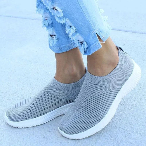 Mandotos flat knitted shoes in neutral beige with a rounded toe and slip-on design, perfect for casual wear.