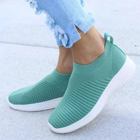 Mandotos flat knitted shoes in neutral tones, showcasing their comfortable, stylish design and textured knit upper.