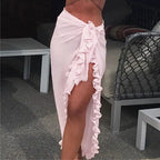 Mandotos GlamourWave chiffon beach wrap draped over a model, showcasing lightweight, elegant fabric for sunny beach days
