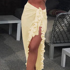 Mandotos GlamourWave chiffon beach wrap draped over a model, showcasing lightweight, elegant fabric for sunny beach days.