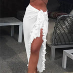 Mandotos GlamourWave chiffon beach wrap draped over a model, showcasing lightweight, elegant fabric for sunny day beachwear.
