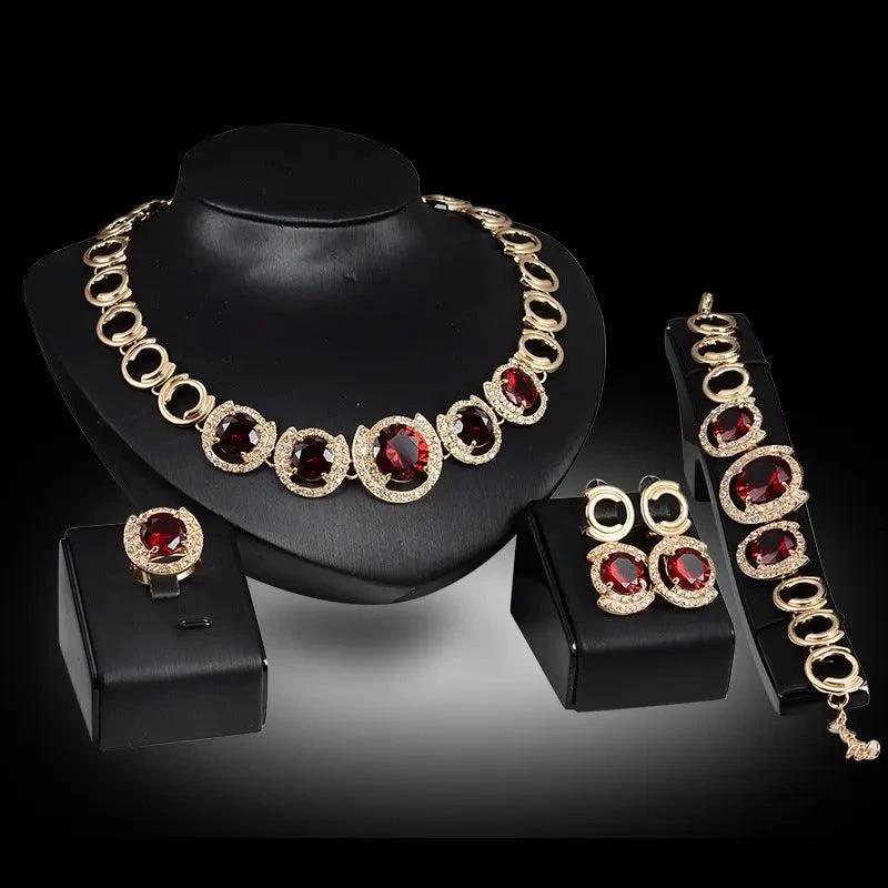 Mandotos gold jewelry set with four pieces featuring blue gemstones, perfect for wedding or special occasion accessories.