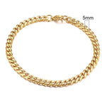 Gold-tone stainless steel Cuban bracelet by MANDOTOS featuring 3-11mm wide links, shown close-up on a neutral background.