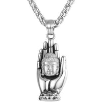 Golden Buddha pendant by MANDOTOS featuring intricate detailing and a polished finish, displayed against a neutral background.
