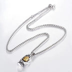 Golden Buddha pendant from MANDOTOS featuring intricate design and polished gold finish, hanging on a delicate chain.