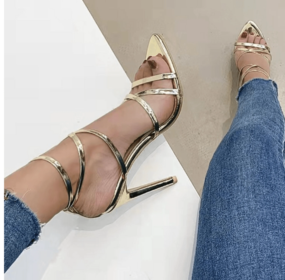 Golden strappy stiletto pumps by MANDOTOS with sleek design and high heels, perfect for elegant evening wear.