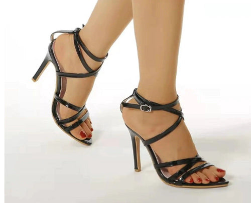 Golden strappy stiletto pumps by MANDOTOS with high heels and elegant design, showcasing their sleek and stylish appearance.