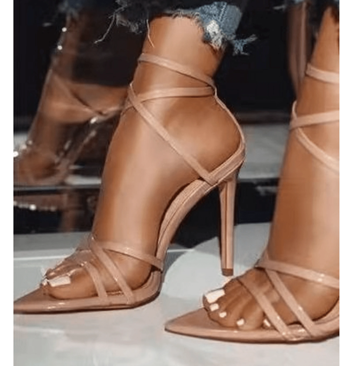 Golden strappy stiletto pumps by MANDOTOS with slender heels and elegant design, perfect for stylish evening wear.