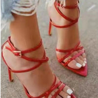 Golden strappy stiletto pumps by MANDOTOS with high heels and elegant design, perfect for formal or evening wear.