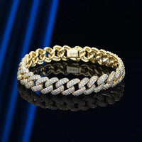18k gold Cuban link bracelet by MANDOTOS, featuring a sleek and shiny gold flex design with secure clasp closure.