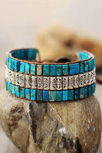 Handmade triple-layer natural stone bracelet by MANDOTOS featuring smooth, polished stones on a durable elastic cord.