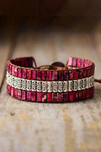 Handmade triple-layer natural stone bracelet by MANDOTOS featuring smooth, rounded stones in earthy tones.