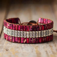 Handmade triple-layer natural stone bracelet by MANDOTOS featuring smooth, multicolored stone beads on an elastic band.