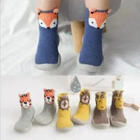 Mandotos Happy Feet toddler shoes in vibrant colors, featuring soft soles and supportive straps for young children.