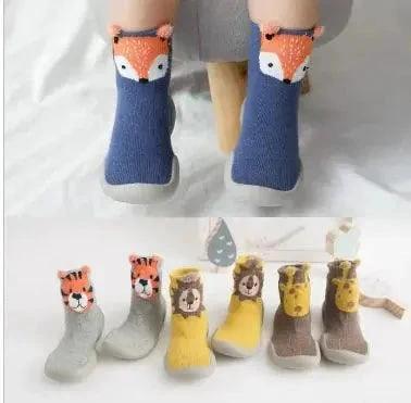 Mandotos Happy Feet toddler shoes in bright colors, featuring soft soles and adjustable straps for young children's comfort.