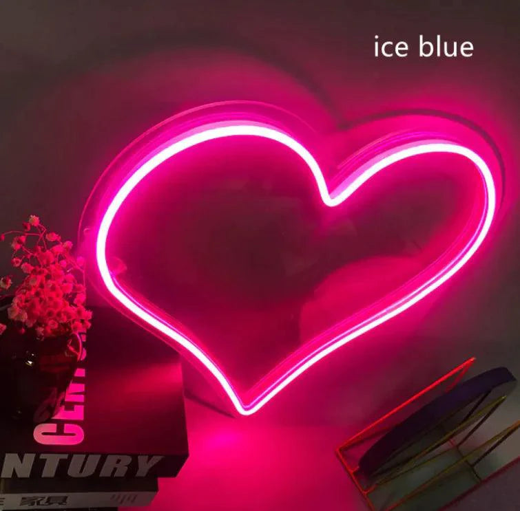 Mandotos Heart Glow LED Neon Light glowing in pink, decorative home or room decor piece with vibrant illumination.