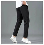 Mandotos Ice Silk men's summer casual pants in black and gray, with elastic waist, breathable fabric, straight-leg design.