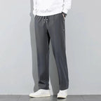 Mandotos Ice Silk men's summer casual pants in black and gray, breathable, elastic, straight-leg sweatpants for outdoor and business wear.