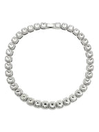 Mandotos Illumina tennis chain with clustered stones and radiant embellishments, showcasing elegant jewelry design and sparkling details.