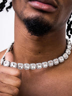 Mandotos Illumina Tennis Chain with clustered stones and radiant embellishments, showcasing elegant, sparkling jewelry design.