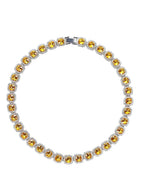 Mandotos Illumina tennis chain with clustered stones and radiant embellishments, showcasing elegant jewelry design.