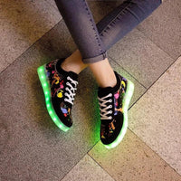 Mandotos LED light-up sneakers with sparkling soles, showcasing the illuminated design and vibrant style for active wear.