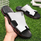 Retro leather men's summer beach slippers by MANDOTOS INTERNATIONAL, flat sandals with open-toe design and comfortable slip-on fit.