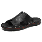 Retro leather men's summer beach slippers by MANDOTOS INTERNATIONAL featuring flat sandal design and casual open-toe style.