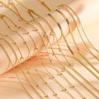 Eight-piece gold-plated waist chain set featuring beaded, sequin, CZ coin designs, adjustable body jewelry from MANDOTOS INTERNATIONAL.