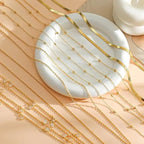 8-piece gold-plated waist chain set with beaded, sequin, CZ coin design, adjustable belly belt jewelry by MANDOTOS INTERNATIONAL.
