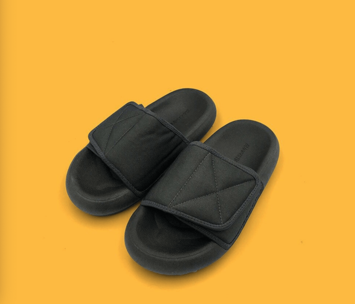 Mandotos International chic grey beach sandals with comfortable sole, featuring stylish design and cushioned footbed.