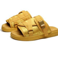 Chic unisex beach slides by MANDOTOS INTERNATIONAL featuring stylish design and comfortable slip-on footwear.