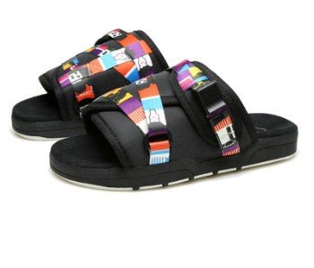 Chic unisex beach slides by MANDOTOS INTERNATIONAL with comfortable straps and casual style, ideal for beach or poolside wear.