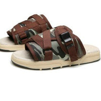 Chic unisex beach slides by MANDOTOS INTERNATIONAL featuring comfortable slip-on design and stylish casual look.