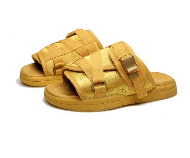 Chic unisex beach slides from MANDOTOS INTERNATIONAL with comfortable strap design and stylish summer footwear.