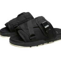 Chic unisex beach slides by MANDOTOS INTERNATIONAL featuring stylish open-toe design and comfortable slip-on style.