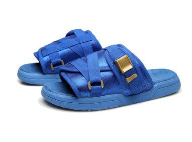 Chic unisex beach slides from MANDOTOS INTERNATIONAL, featuring casual slip-on style and comfortable design for beachwear.