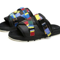 Chic unisex beach slides by MANDOTOS INTERNATIONAL featuring stylish design and comfortable slip-on footwear for summer.