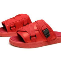 Chic unisex beach slides by MANDOTOS INTERNATIONAL featuring stylish open-toe design and comfortable slip-on style.