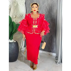 Elegant African V-neck maxi dress by Mandotos International, suitable for wedding parties, featuring vibrant fabric and stylish design.