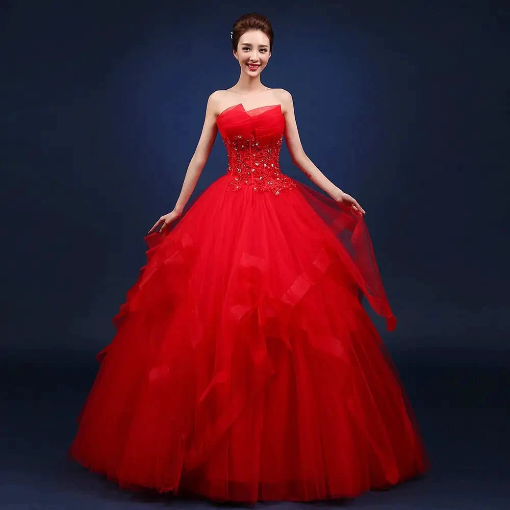 Elegant one-shoulder bridal gown by MANDOTOS INTERNATIONAL featuring a flowing design and intricate lace details.